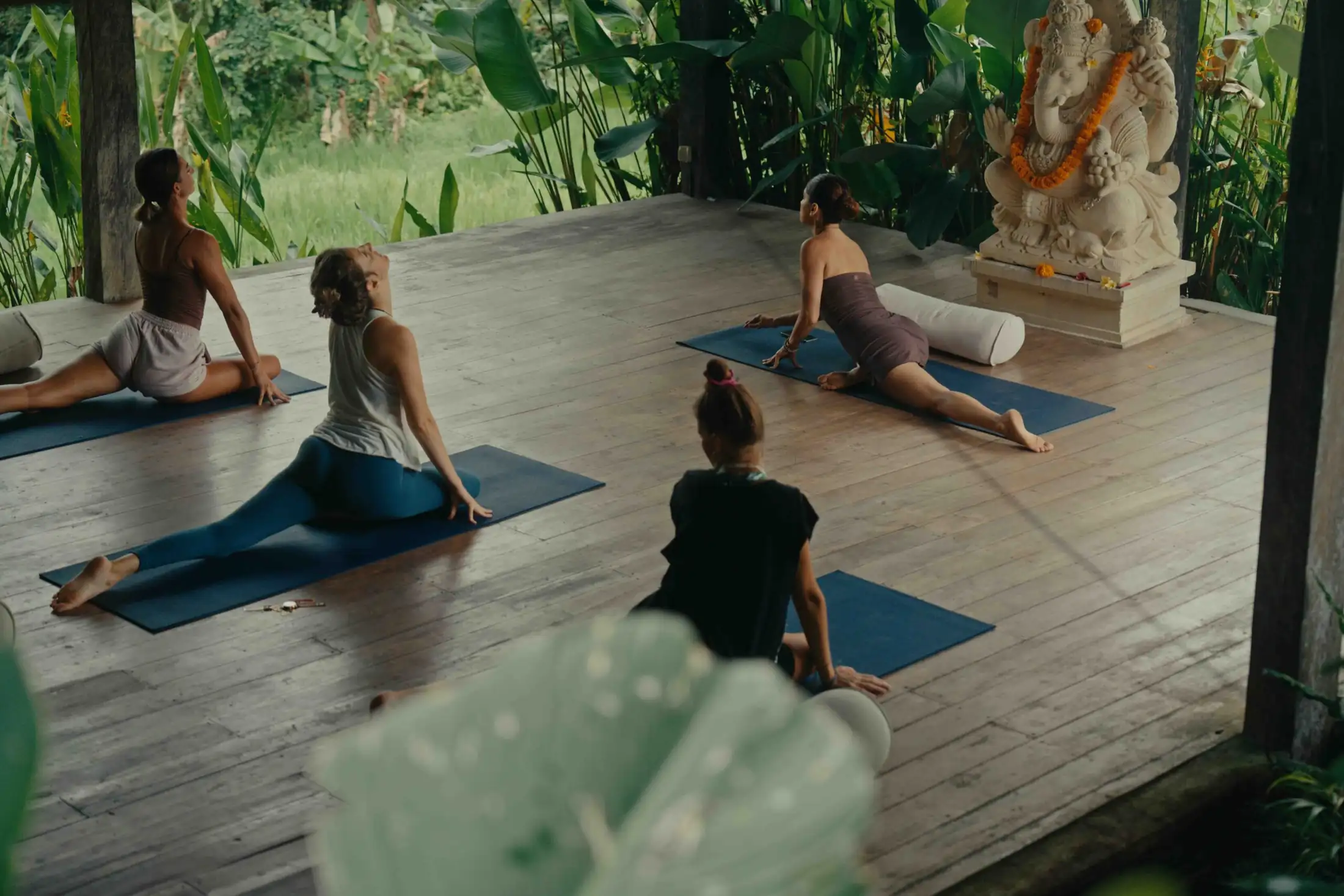 The open yoga shala at Senses Bali, surrounded by the green outside Ubud